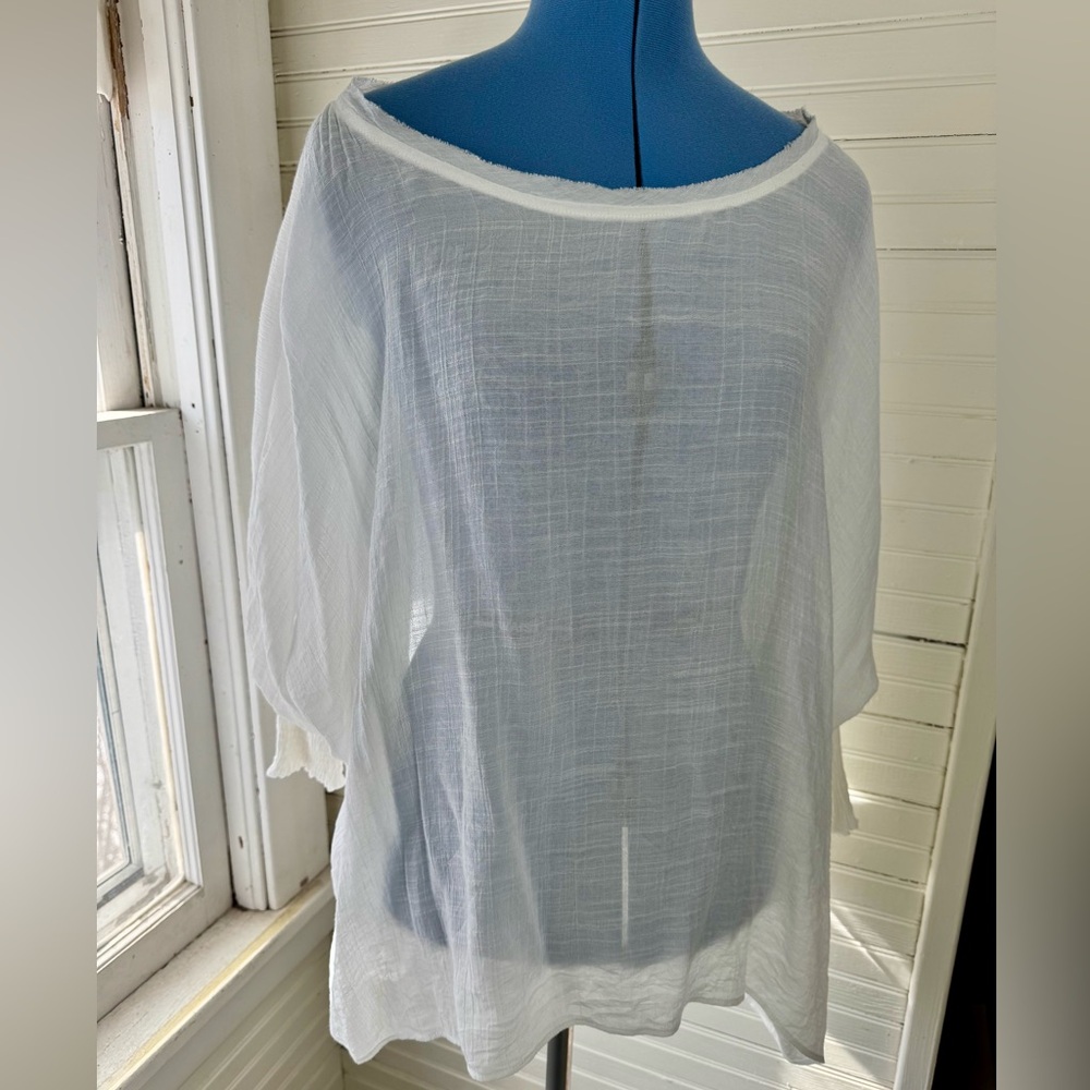 Sheer White Dolan sleeved with smocked cuffs